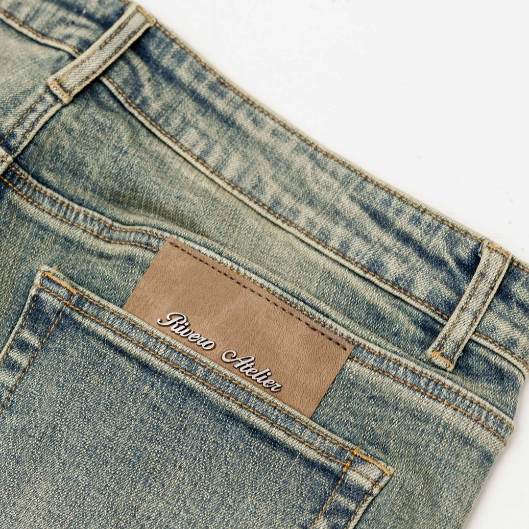 RIVERO - RAISED MONOGRAM BUTTONED DENIM JEANS