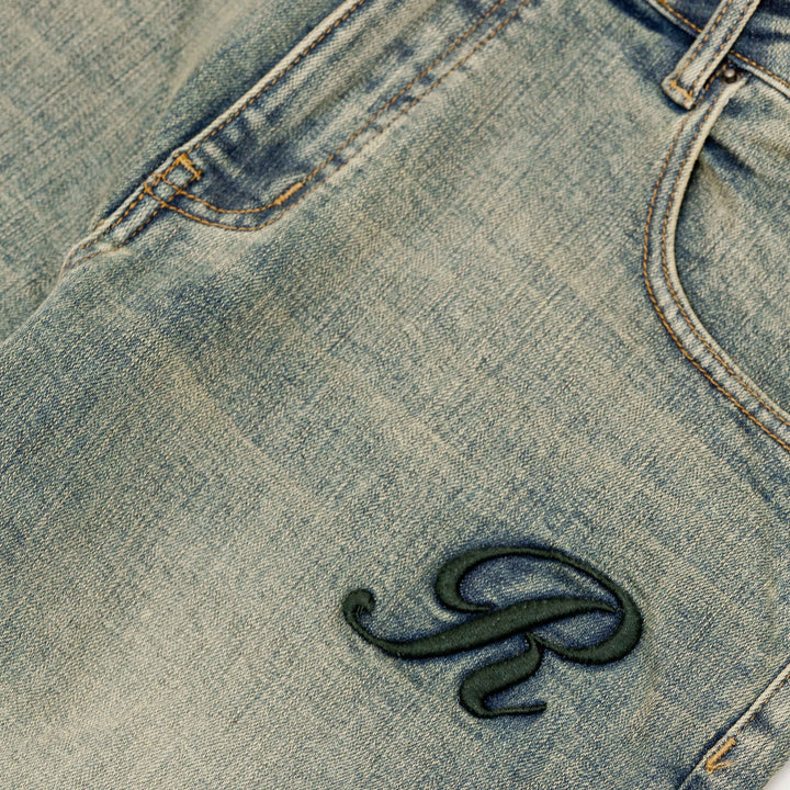 RIVERO - RAISED MONOGRAM BUTTONED DENIM JEANS